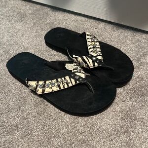 Zebra hide flip flops